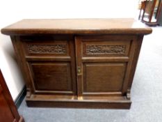 An oak double door low sideboard,