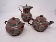 A three piece Chinese ceramic and metal overlayed tea service