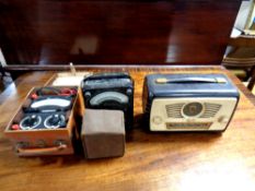 An Ultra vintage radio together with a voltmeter,