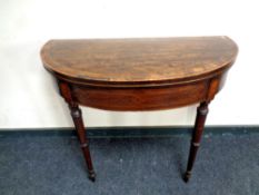 A 19th century D-shaped card table,