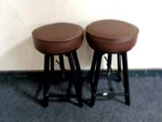 A pair of adjustable circular stools