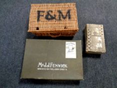 Four metal storage boxes together with a wicker basket and a vintage box