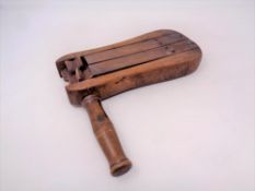 An antique wooden click clack