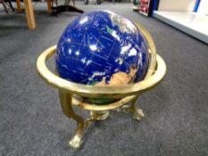 A Gemstone globe on brass stand