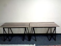 Two trestle tables together with a quantity of wool blankets, camping equipment,