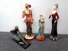 Four large decorative figures depicting ladies