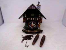 A continental cuckoo clock with weights