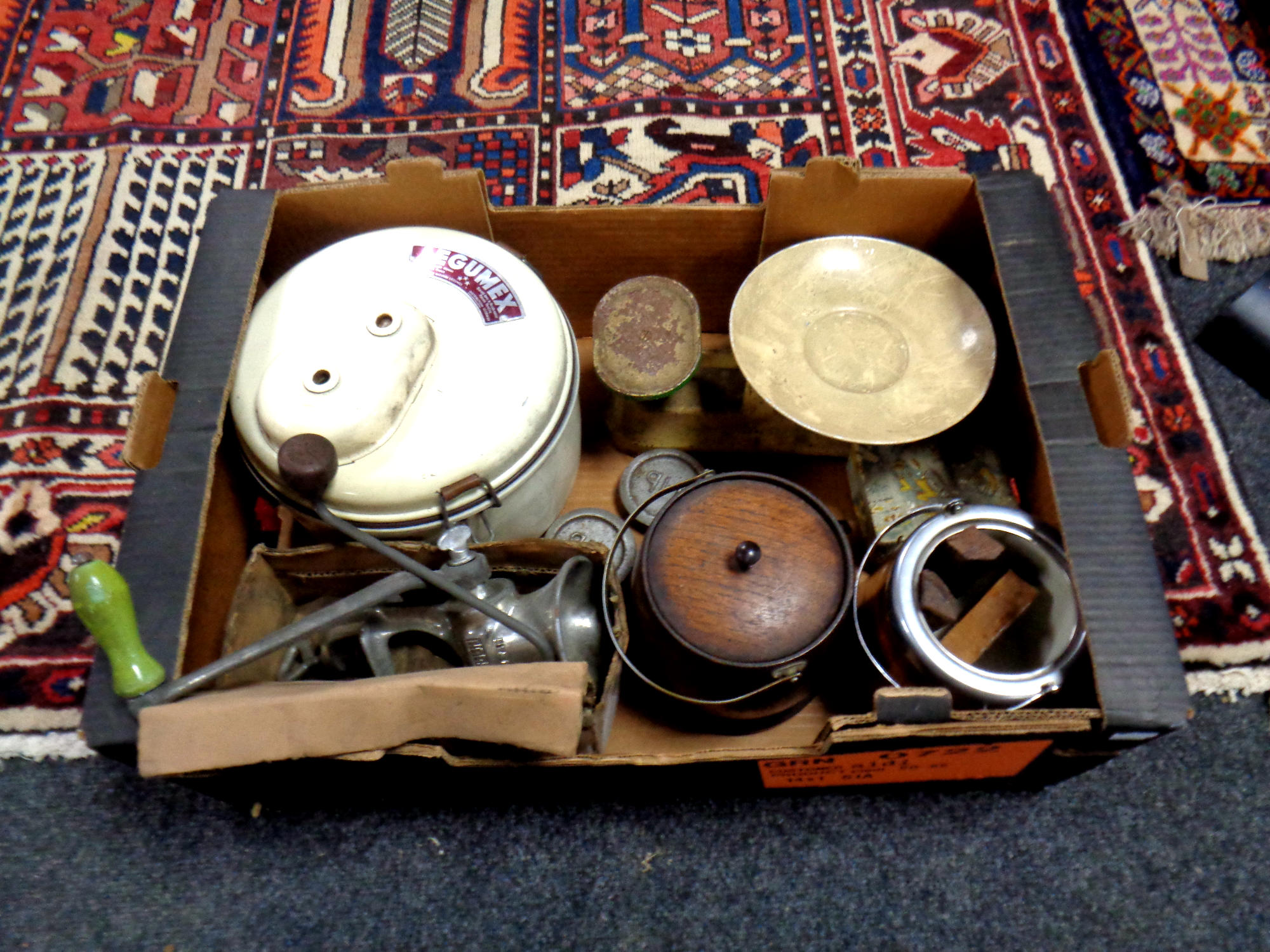 A box containing kitchenalia, scales, mincer,