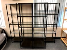 Three metal shelving display units with glass shelves, width 100 cm each, height 175.