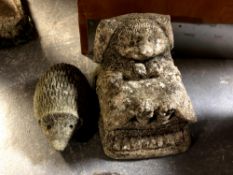 Two concrete garden hedgehog ornaments