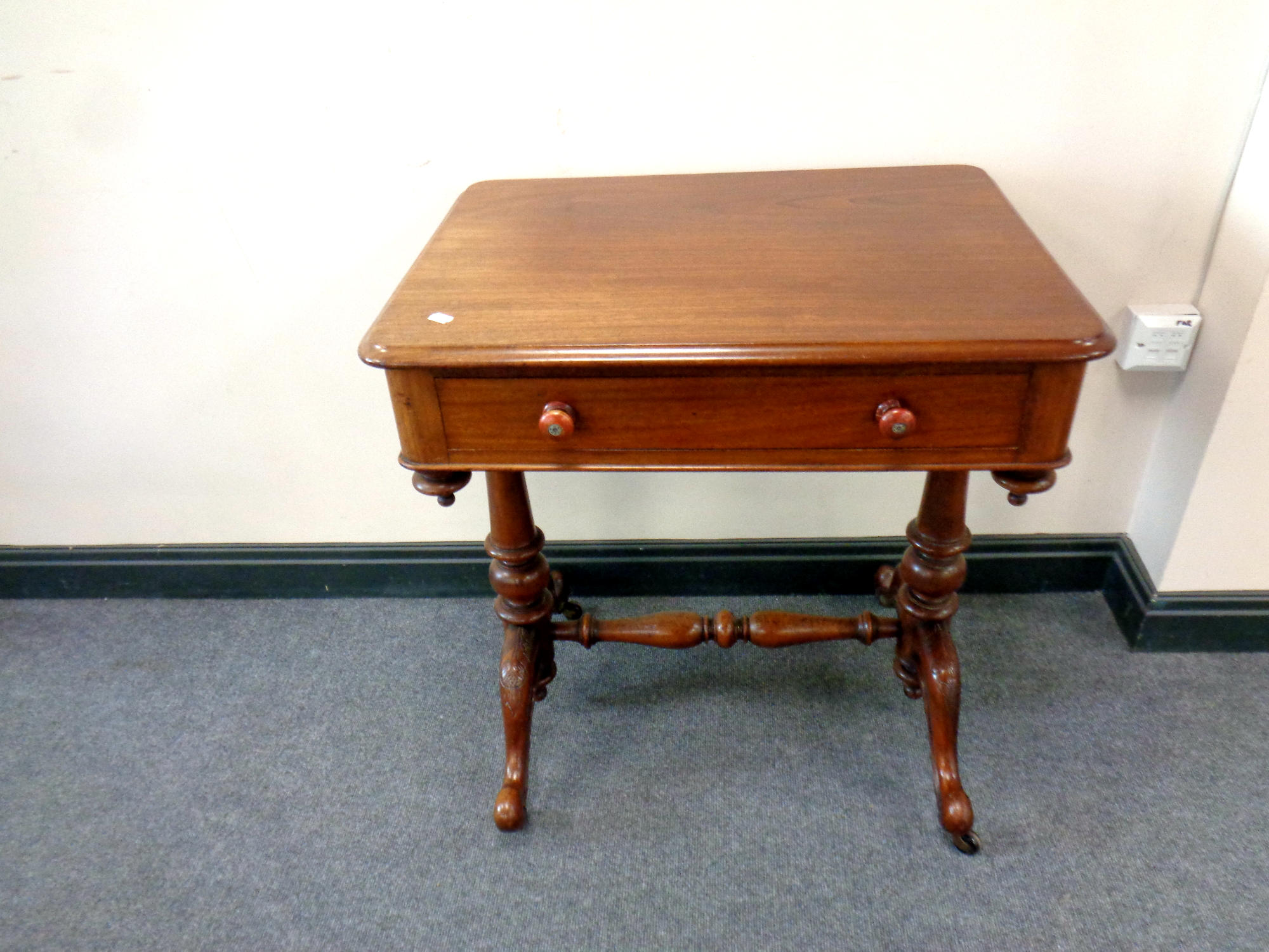 A Victorian mahogany side table fitted with a drawer,