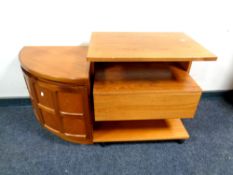 A Nathan teak corner low cabinet together with a teak trolley fitted with a drawer