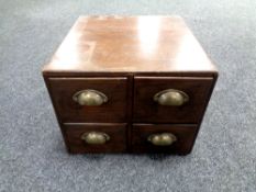 An early 20th century oak four drawer office chest