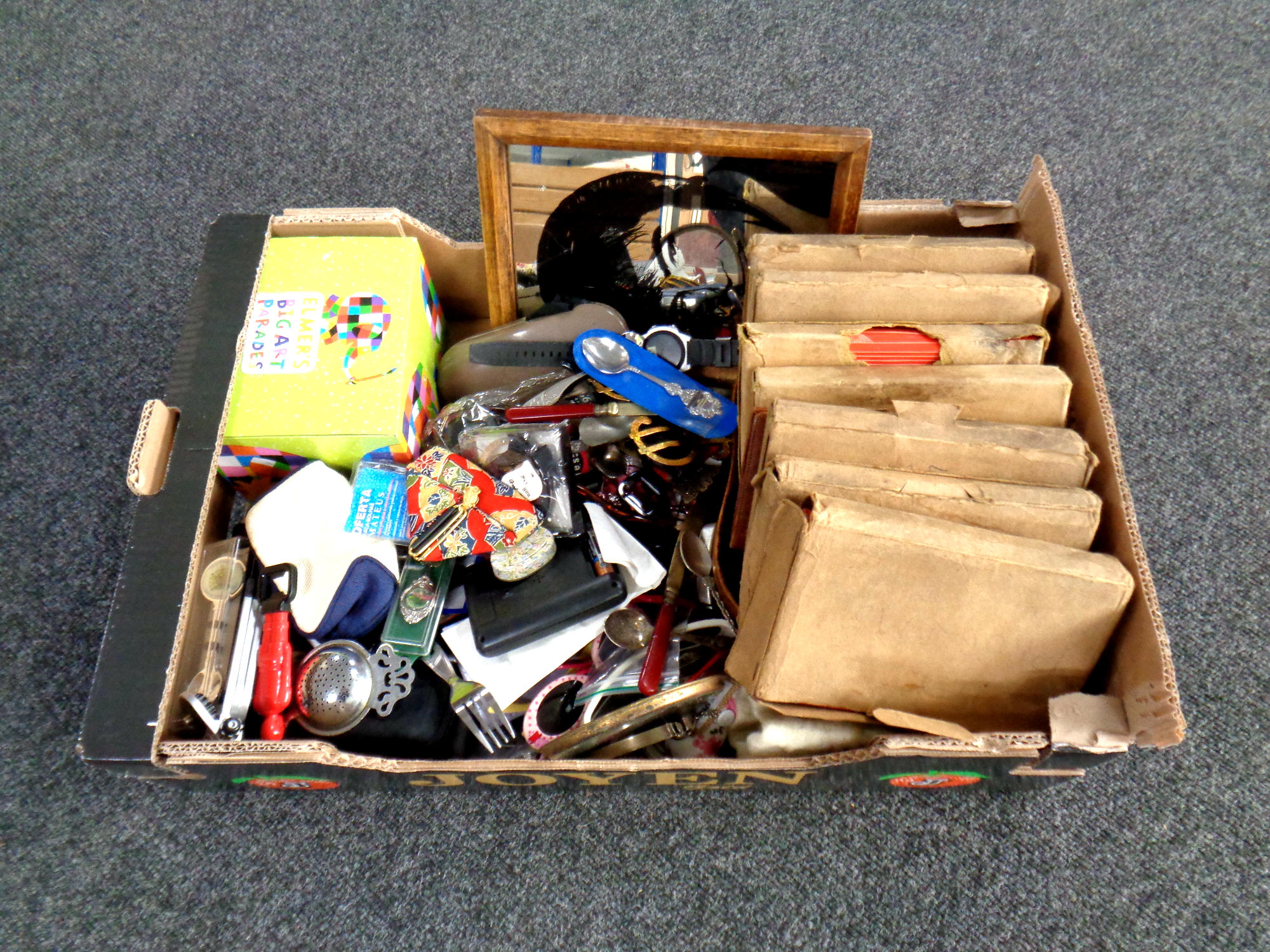 A box containing a quantity of miscellaneous items including cutlery, sunglasses,
