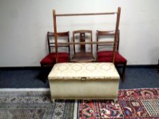 An early 20th century wooden folding towel rail together with three dining chairs and a loom box