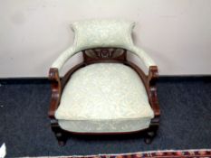 A late 19th century upholstered salon armchair,