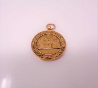 A 9ct gold commemorative war memorial medal, Boldon Colliery CONDITION REPORT: 17.