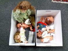 Four boxes containing antique and later dolls, doll parts,