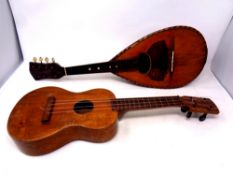 An inlaid antique mandolin together with a small ukulele