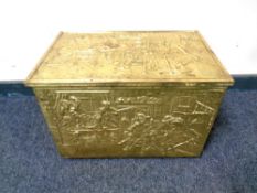 An embossed brass storage box