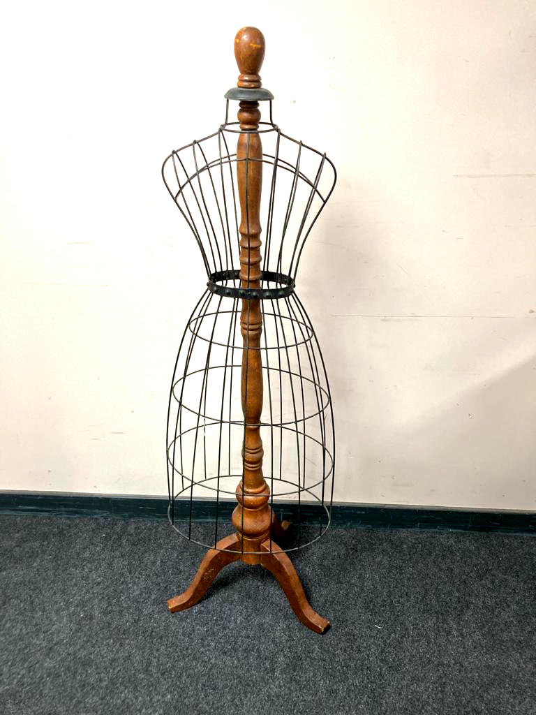 A late nineteenth century style mannequin with metal frame on stand, height 153 cm.