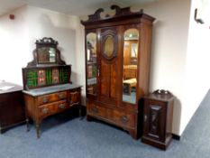 A Victorian four piece Art Nouveau style walnut bedroom suite comprising of mirrored wardrobe,