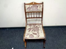 A late Victorian inlaid mahogany salon chair,