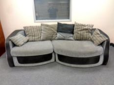 A two tone grey three seater settee,