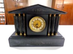 A Victorian black slate mantel clock