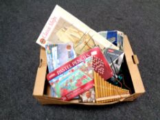 A box containing artist's materials, wooden pipes,