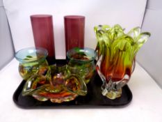 A tray of coloured glass including vases