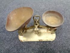 A vintage set of kitchen scales with brass pans
