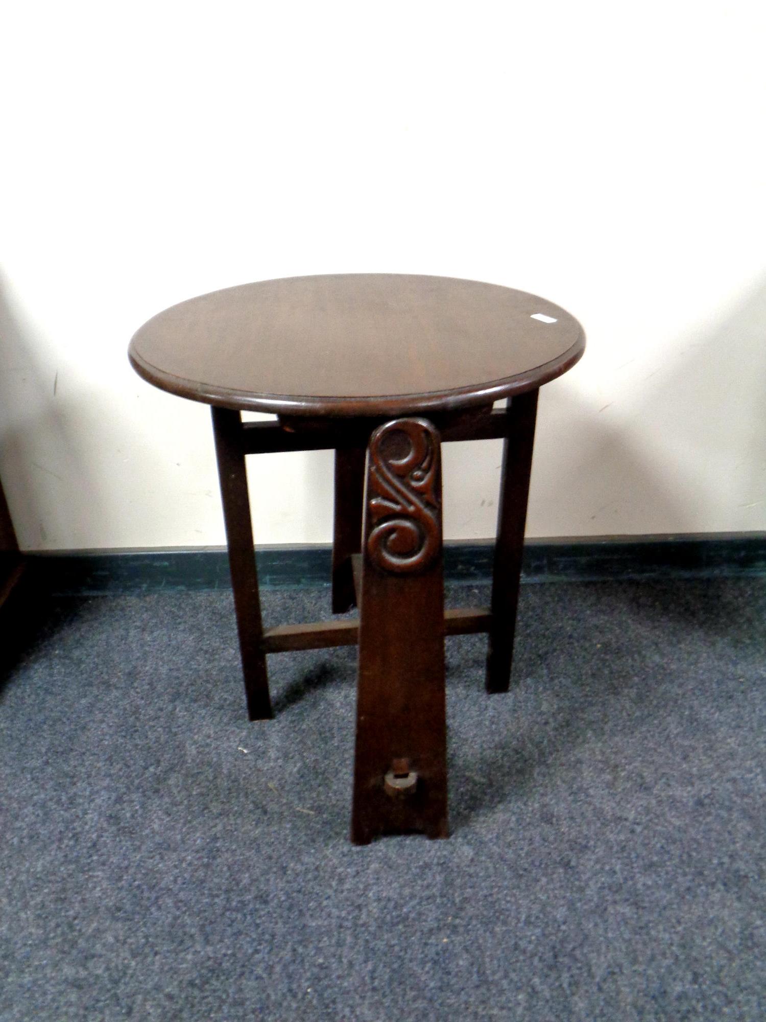 An Arts and Crafts style oak folding table,