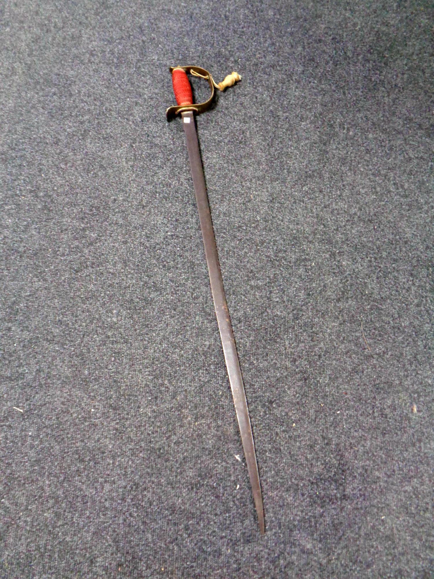 An antique brass handled sword