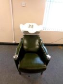 A green vinyl hairdressing wash station with ceramic basin and tap