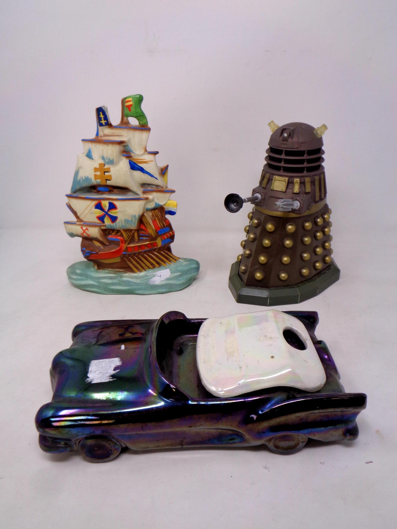 A continental ceramic figure of a tall ship together with a ceramic lustre car and a 20th century