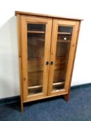 A pine double door cabinet,