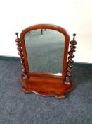A Victorian mahogany dressing table mirror with barley twist supports,