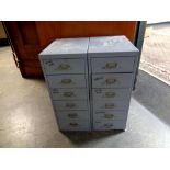 A pair of metal six drawer chests