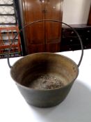 A large brass jam pan