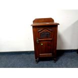 An Edwardian mahogany pot cupboard,