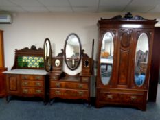 A four piece Victorian mahogany and walnut bedroom suite comprising of double door wardrobe,