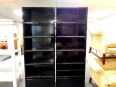 A pair of black high gloss open bookshelves fitted with drawers at the base, each 79 cm wide,
