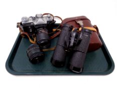 A Zenit-E camera together with a pair of Karl Zeiss binoculars in carry case