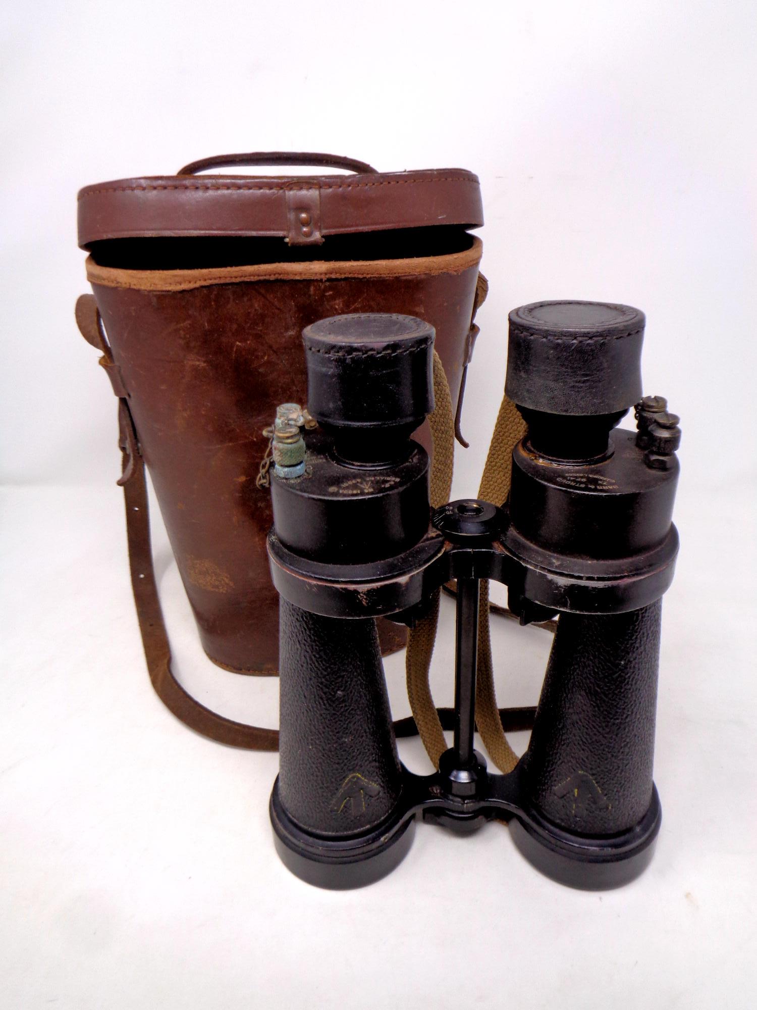 A pair of early 20th century Barr and Stroud military issue binoculars in brown leather case