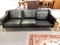 A continental black leather three seater settee CONDITION REPORT: Missing two