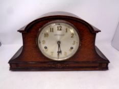 An early 20th century oak cased mantle clock