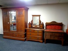 A good quality late 19th century Art Nouveau style oak four piece bedroom suite comprising of