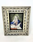 A late 19th/early 20th century portrait on ivory after Delveccio depicting the Madonna with child