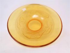 An early 20th century amber glass bowl decorated with greyhounds